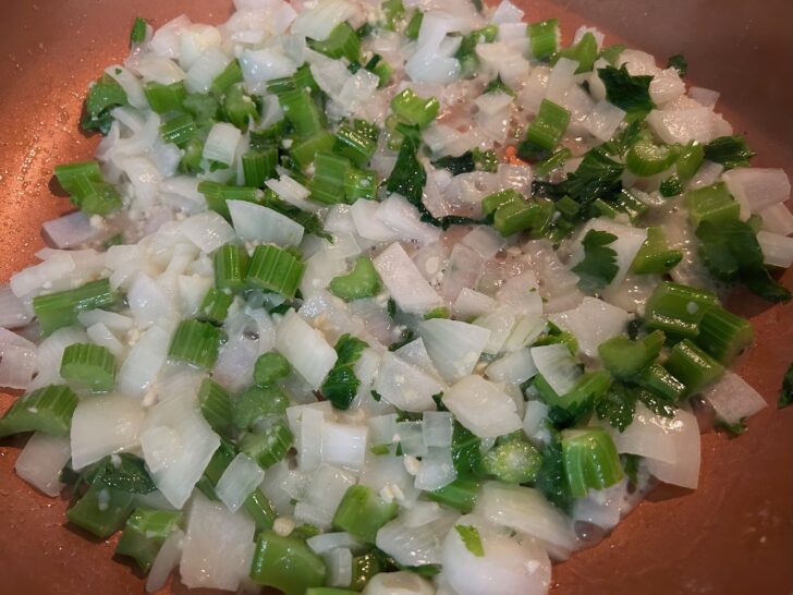 onion and celery, simmering in pan