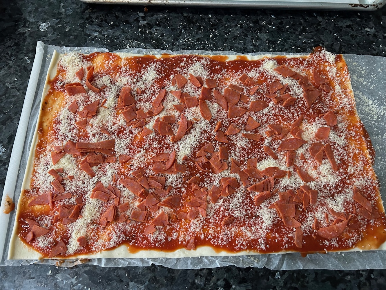 puff pastry with sauce, cheese, and pepperoni