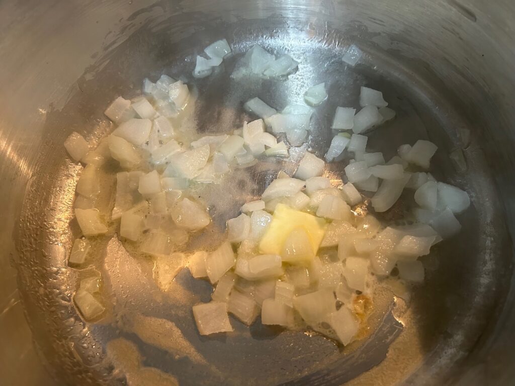 onions and butter sautéing in pan