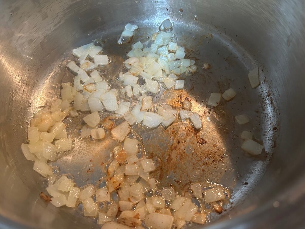 onions and butter sautéing in pan