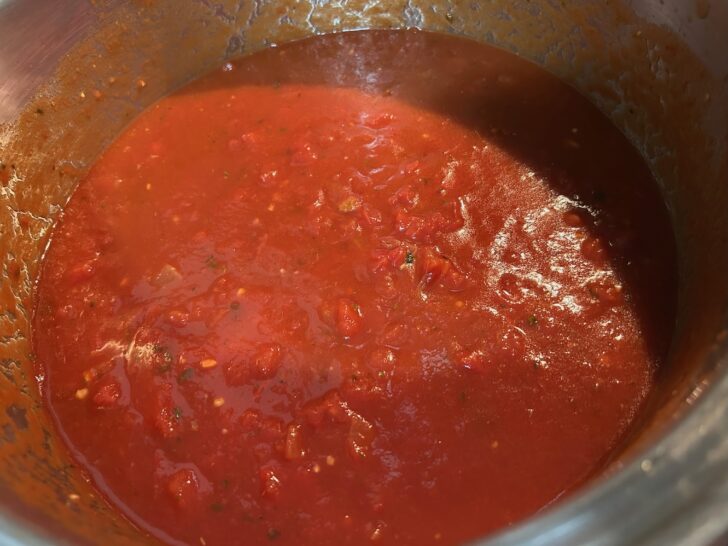 tomato basil soup cooking in pot