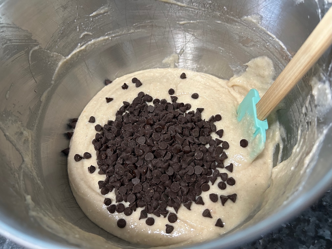 cake batter with chocolate chips about to be stirred in