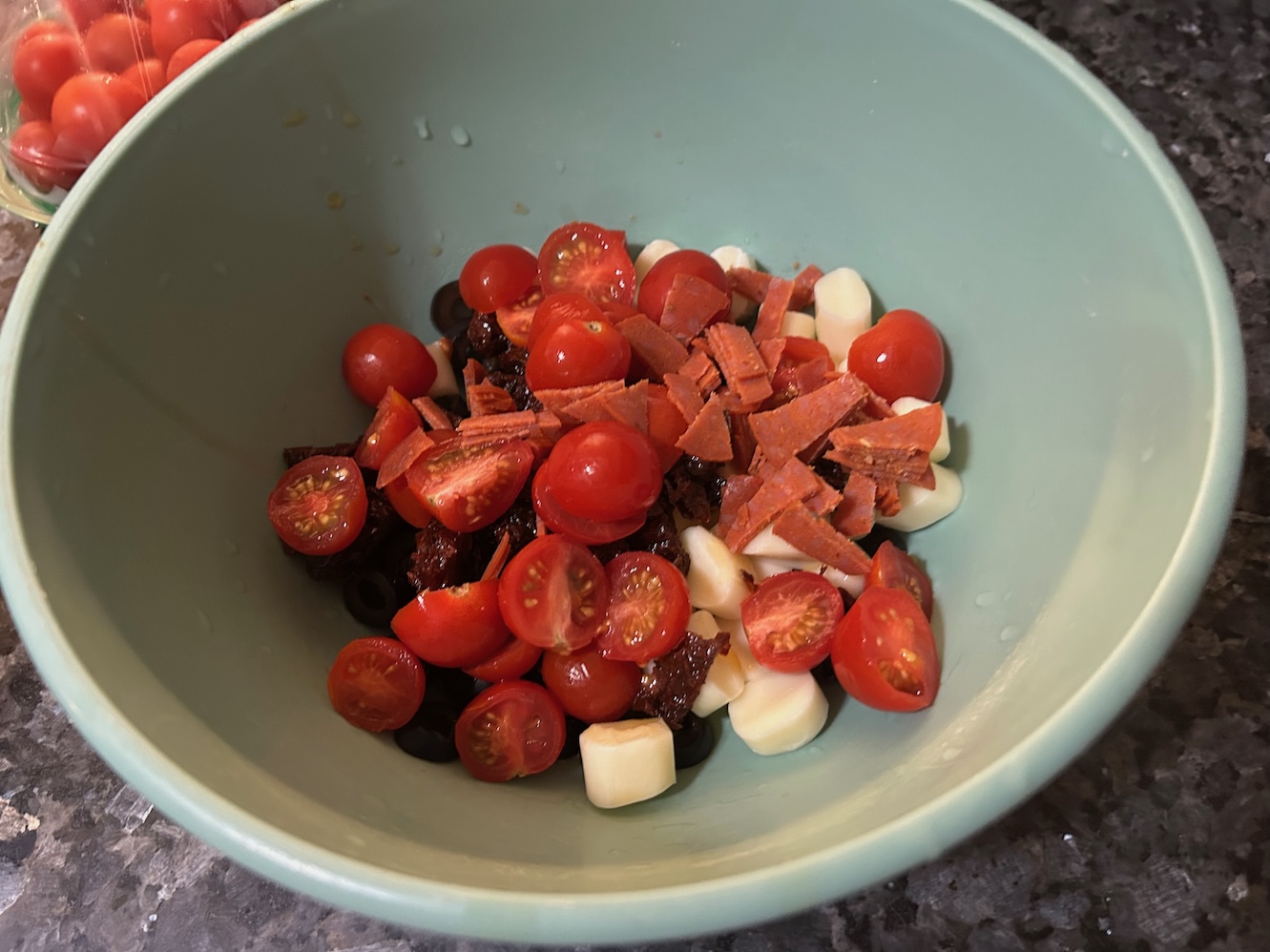 chopped tomatoes, cheese, pepperoni, black olives