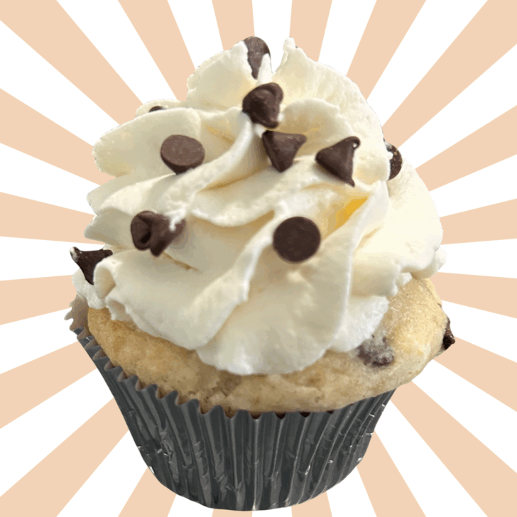 gorgeous cannoli cupcake with whipped cream frosting and chocolate chips