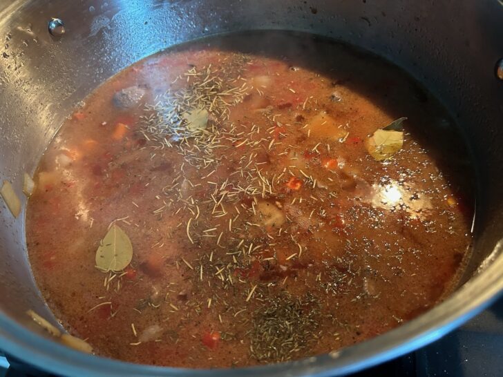 Rustic Italian Beef Stew in pan simmering