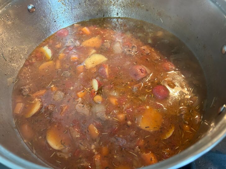 Rustic Italian Beef Stew in pan cooking