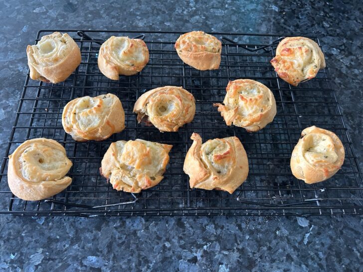 crescent roll pinwheels on cooling rack
