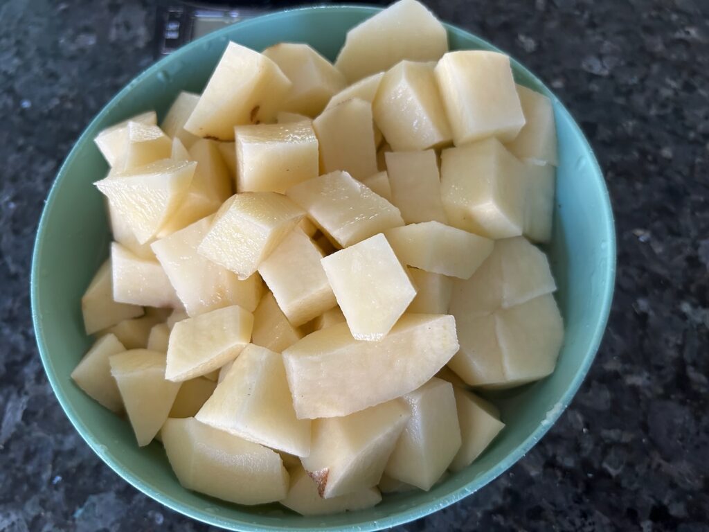 cubed raw potatoes in bowl
