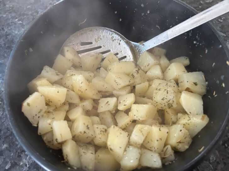 potatoes coated in oil and herbs